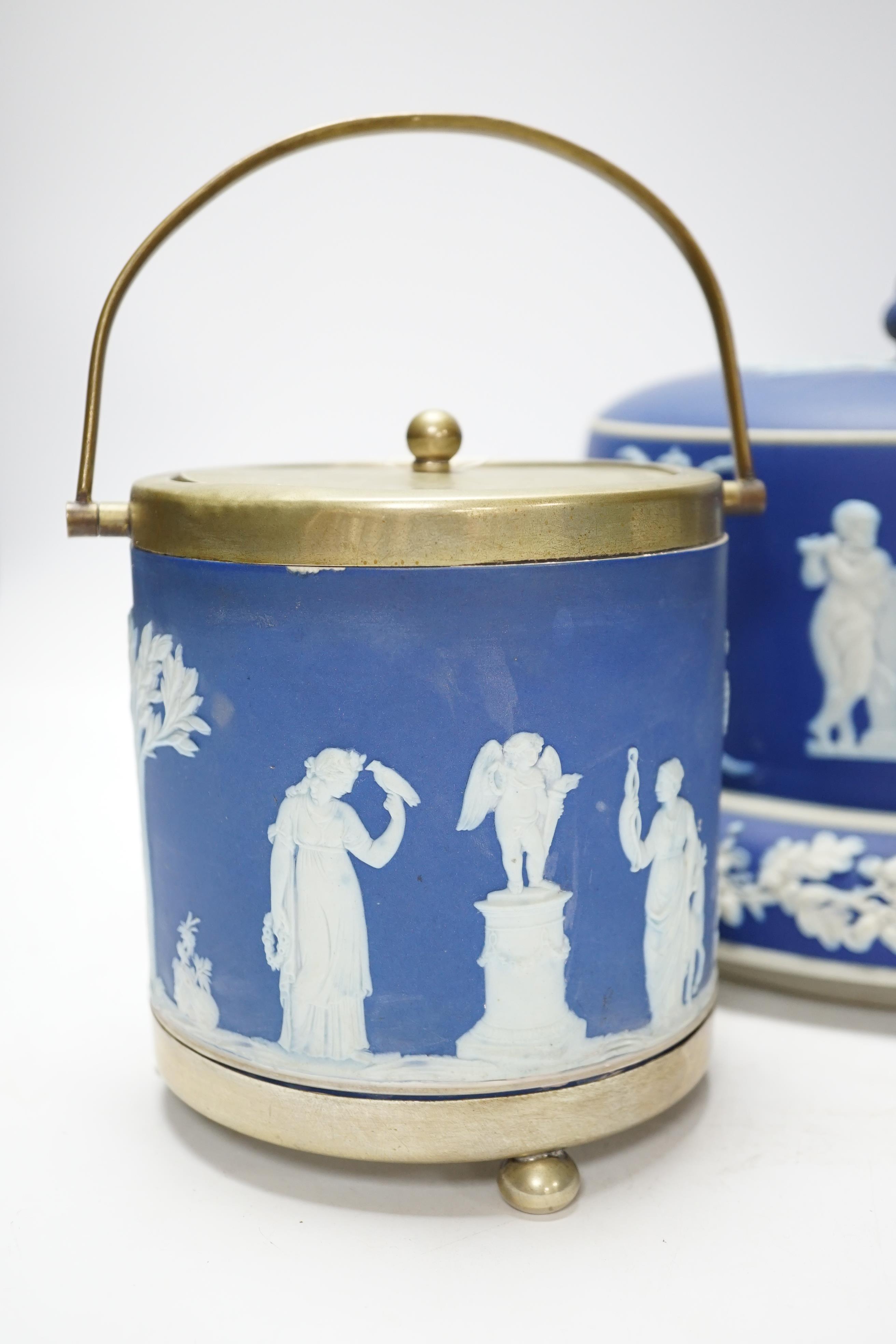A Victorian Jasper ware cheese dome, a Wedgwood biscuit barrel and a transfer printed blue and white mug, largest 23cm in diameter